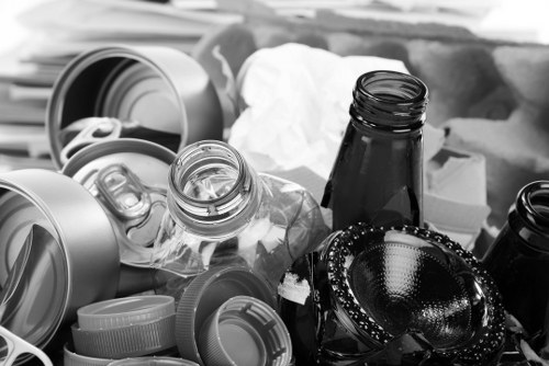 Company vehicle and crew preparing for a commercial waste collection